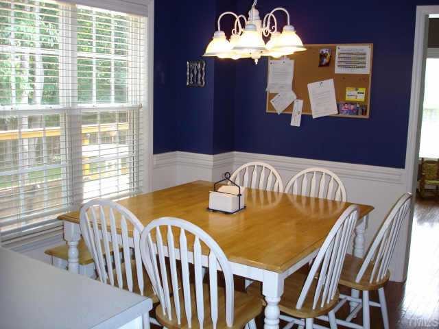 3521 Boren Court Raleigh, NC 27616 - Photo 4 of 10 a view of a dining room with furniture a chandelier and wooden floor