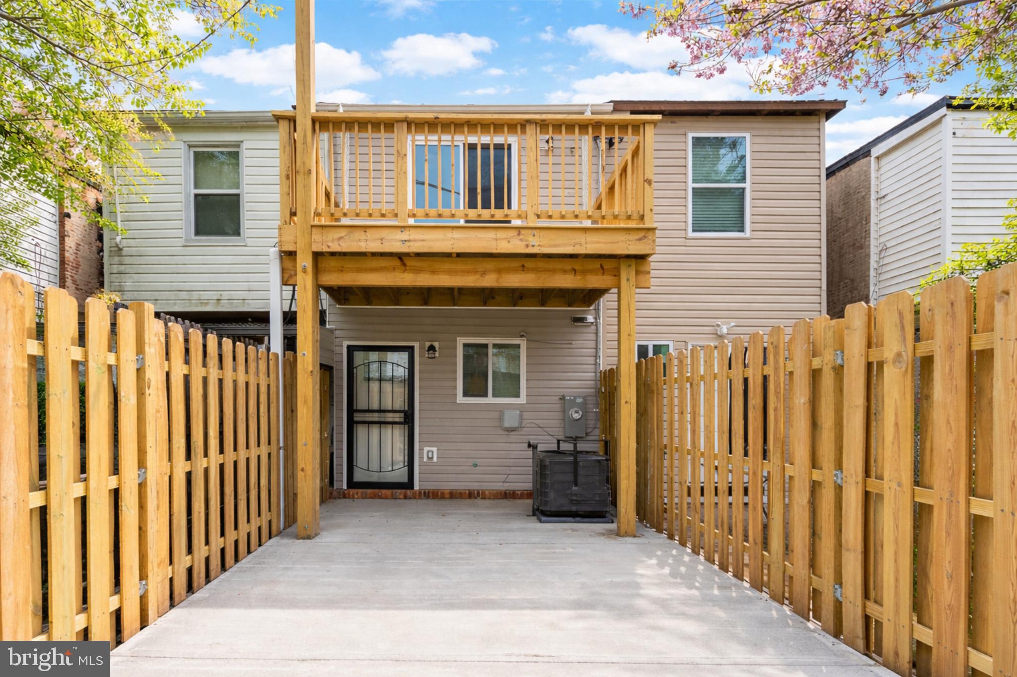 1610 Federal Street Baltimore, MD 21213 - Photo 2 of 3 a view of a house with wooden fence