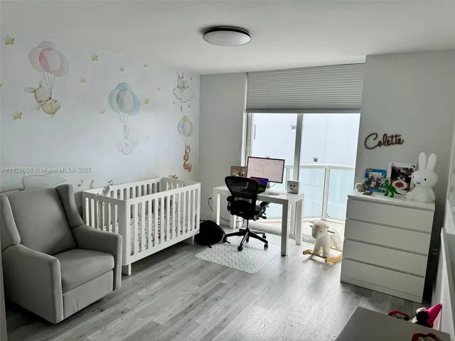 a bedroom with furniture and a window