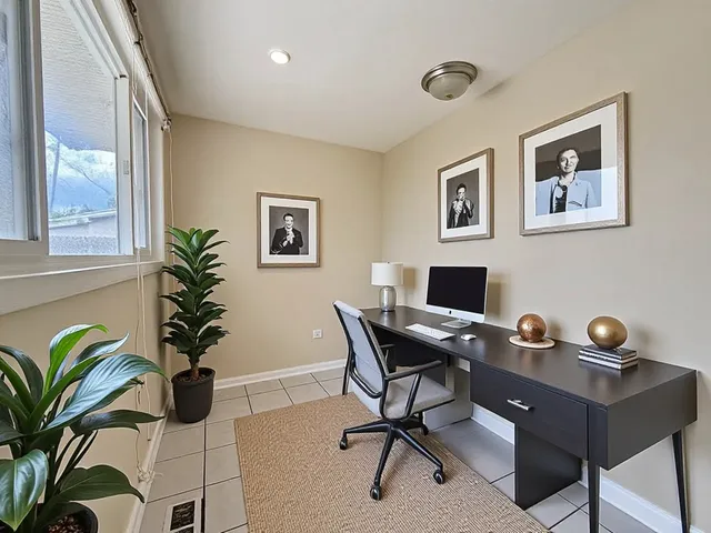 a kitchen with a stove a microwave and wooden cabinets