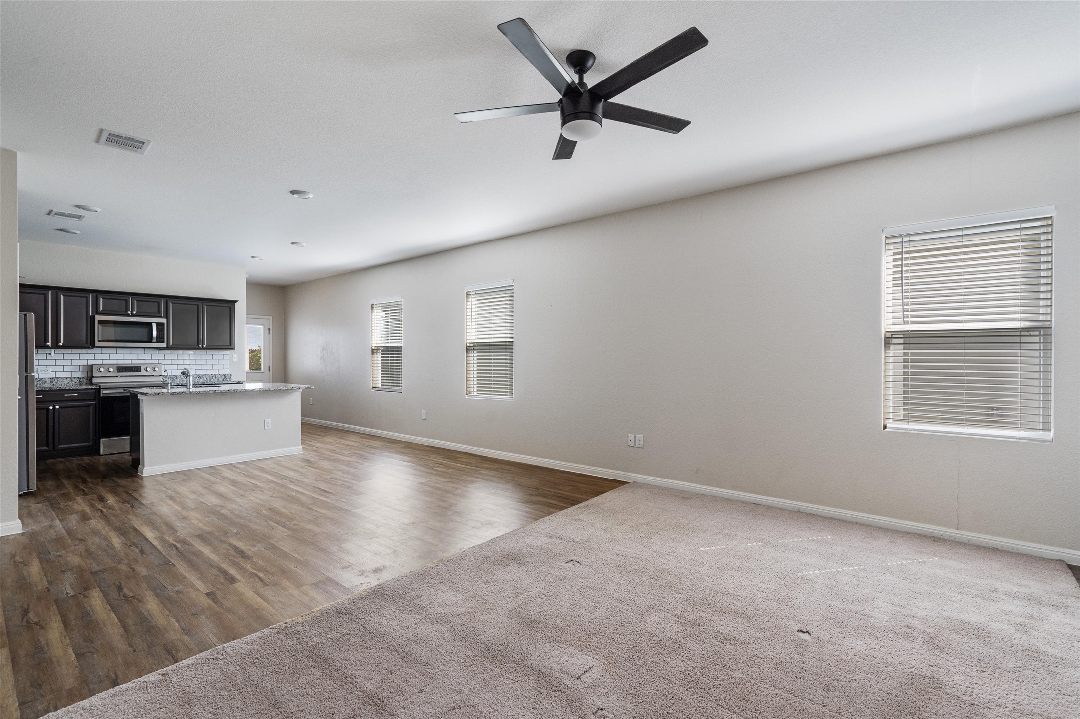 205 Athena Way Jarrell, TX 76537 - Photo 5 of 17 Carpeted area will be replaced with LVP to match.