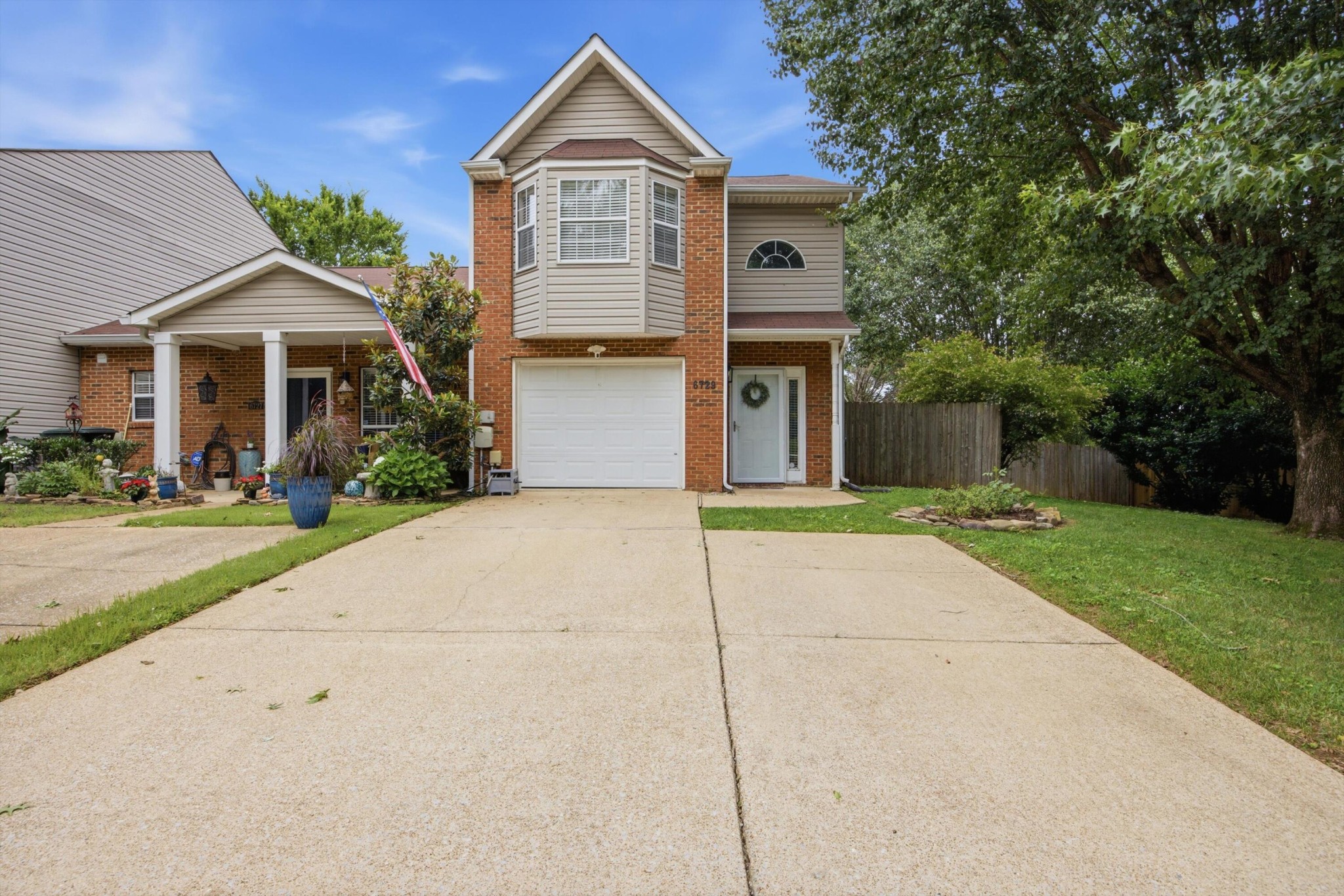 6729 Hickory Trace Circle Chattanooga, TN 37421 - Photo 1 of 30 a front view of a house with a yard