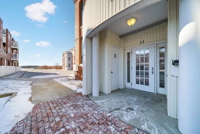 an aerial view of a house with a mountain