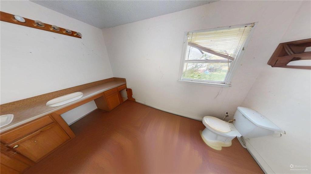 688 Main Street Whitesburg, GA 30185 - Photo 18 of 34 a bathroom with a toilet