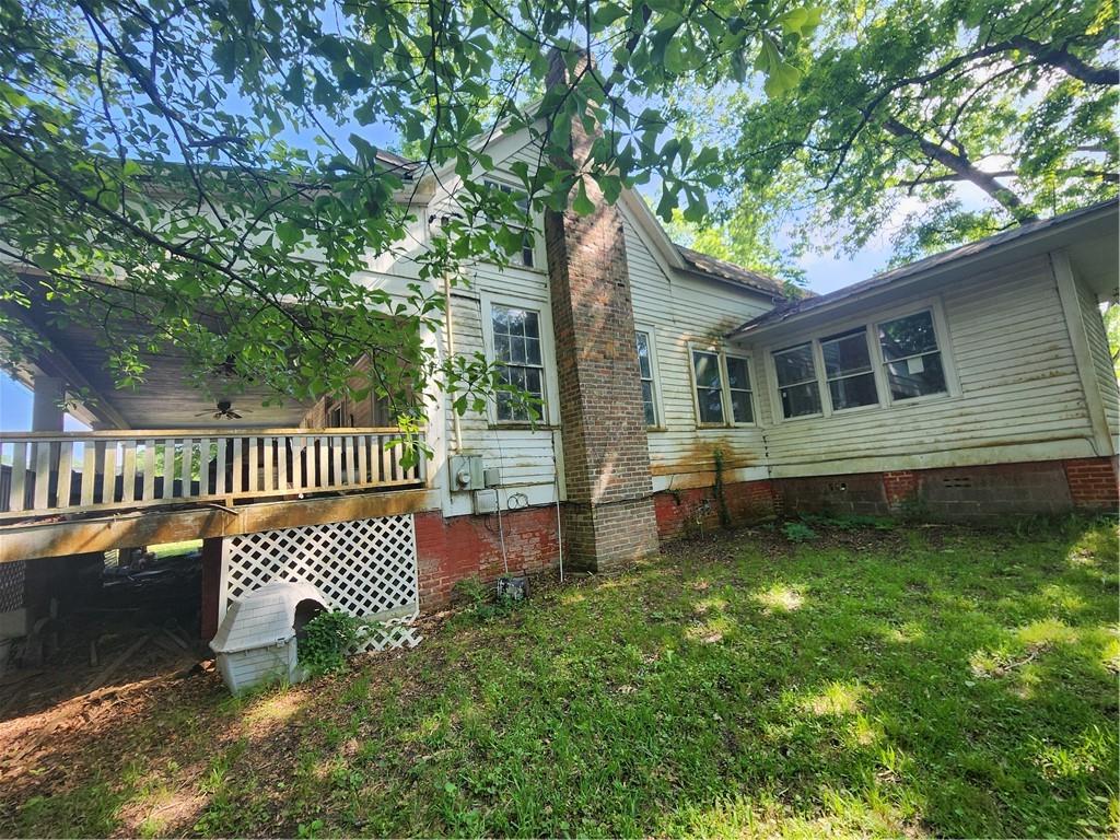 688 Main Street Whitesburg, GA 30185 - Photo 26 of 34 a view of a house with a yard