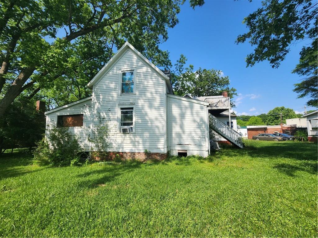 688 Main Street Whitesburg, GA 30185 - Photo 30 of 34 a front view of house with yard and green space