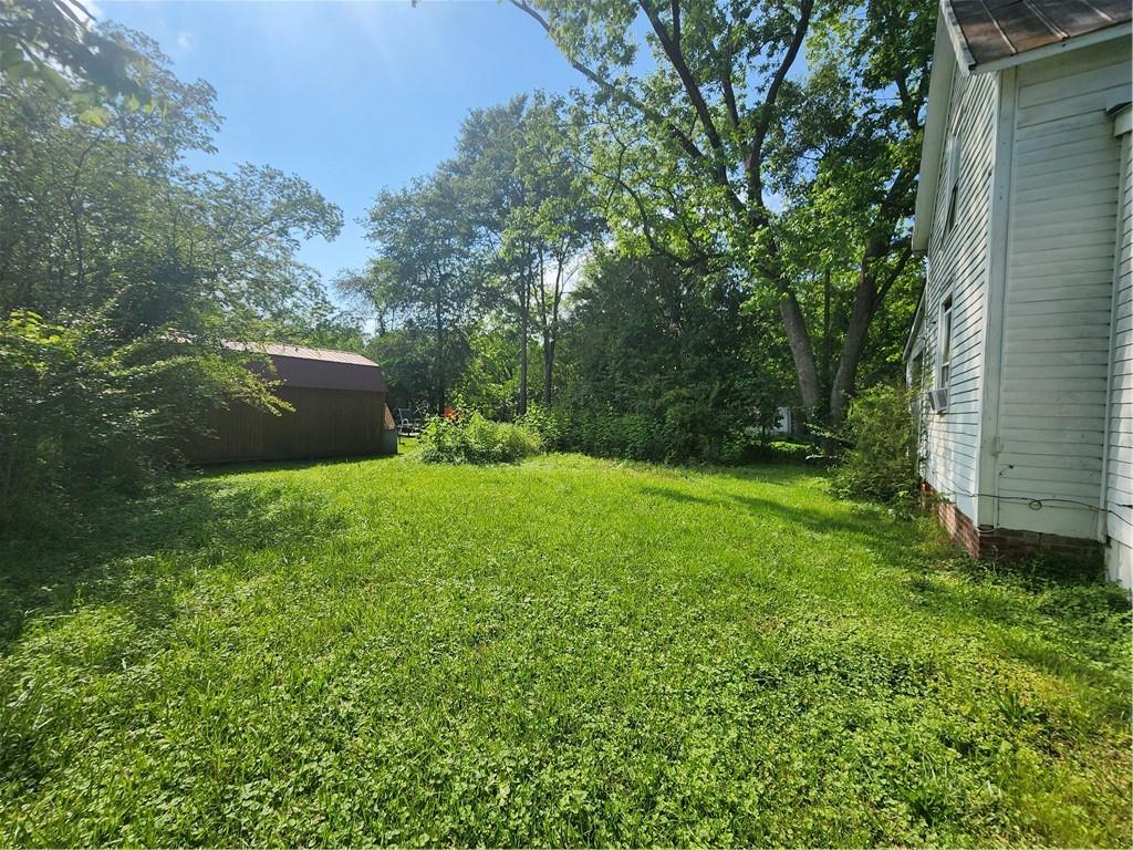 688 Main Street Whitesburg, GA 30185 - Photo 33 of 34 a view of a backyard with a garden