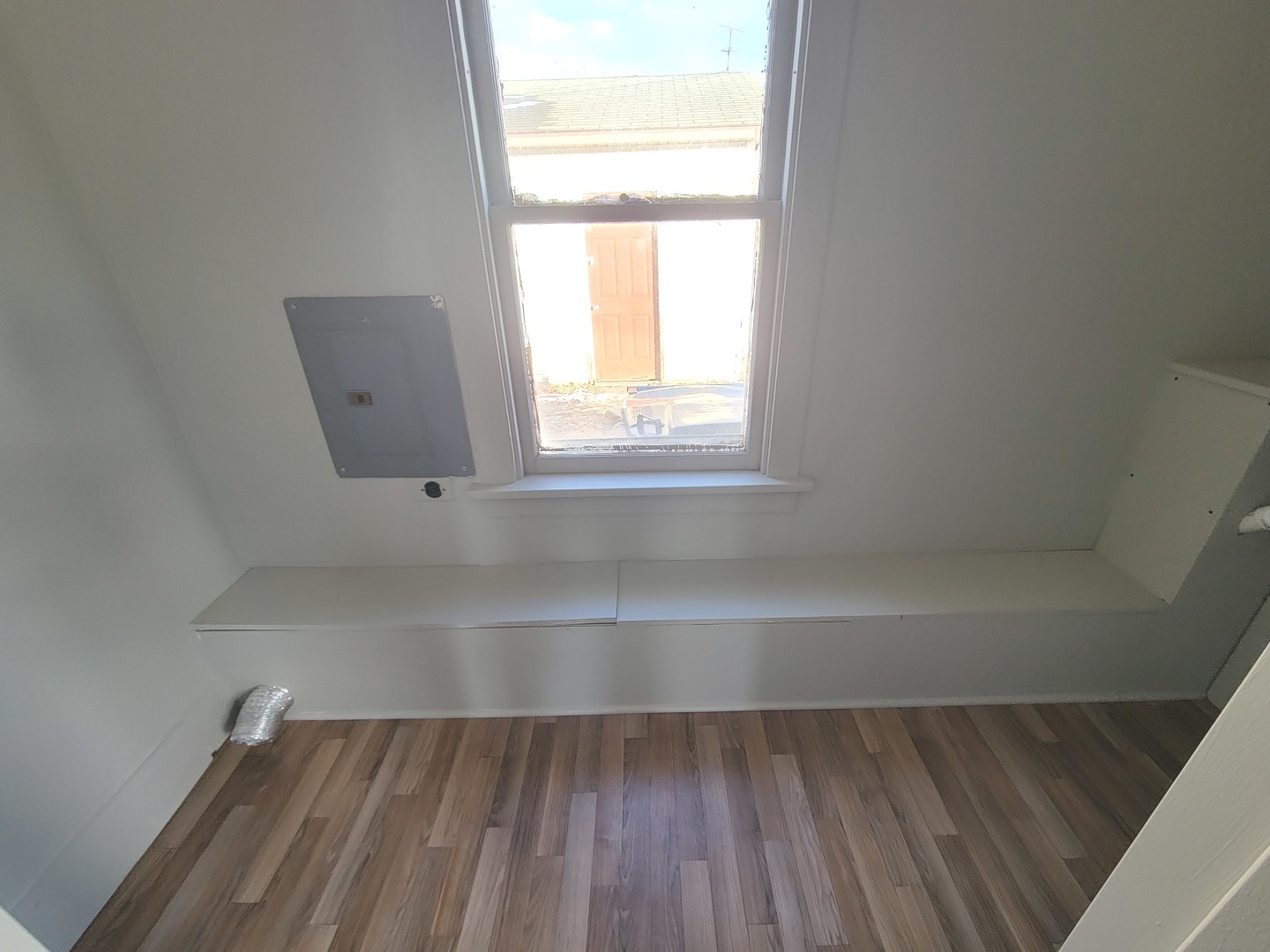 802 Deleon Street Ottawa, IL 61350 - Photo 19 of 22 a view of an empty room with wooden floor and a window