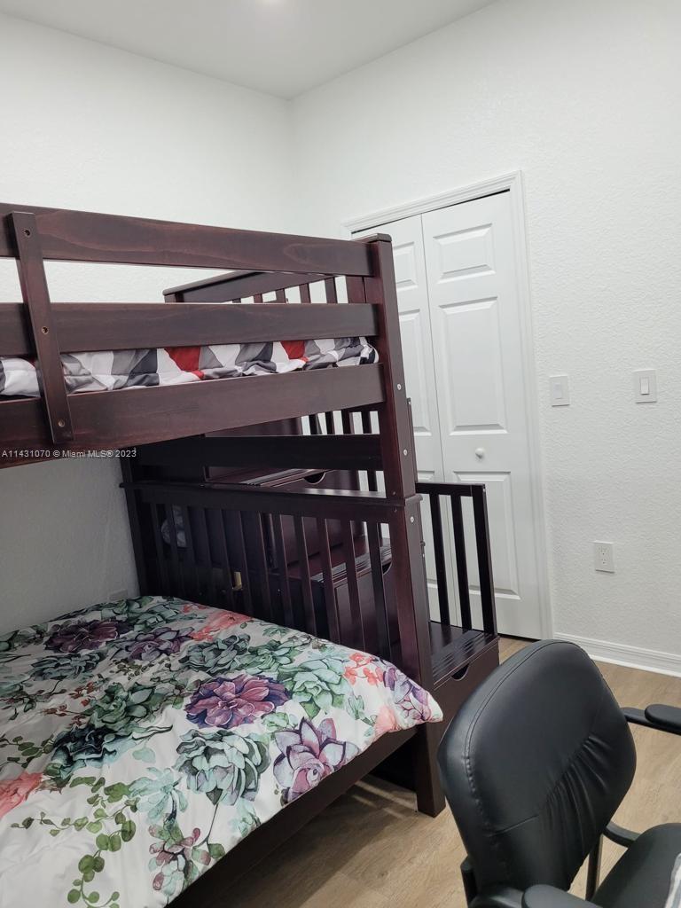 16383 Southwest 44th Terrace Miami, FL 33185 - Photo 14 of 24 a bedroom with a bed and a closet