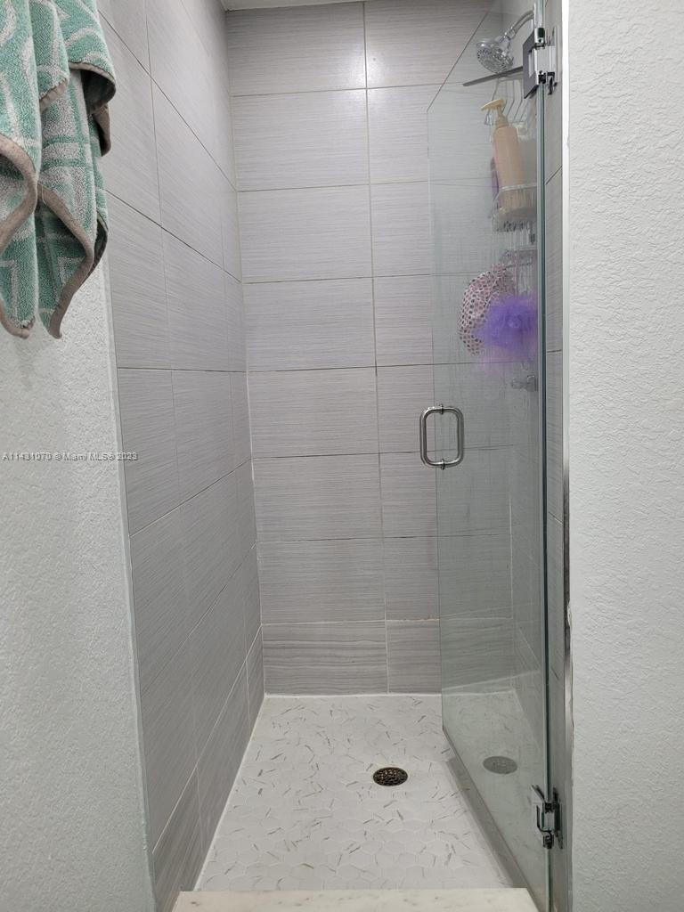 16383 Southwest 44th Terrace Miami, FL 33185 - Photo 16 of 24 a bathroom with a shower