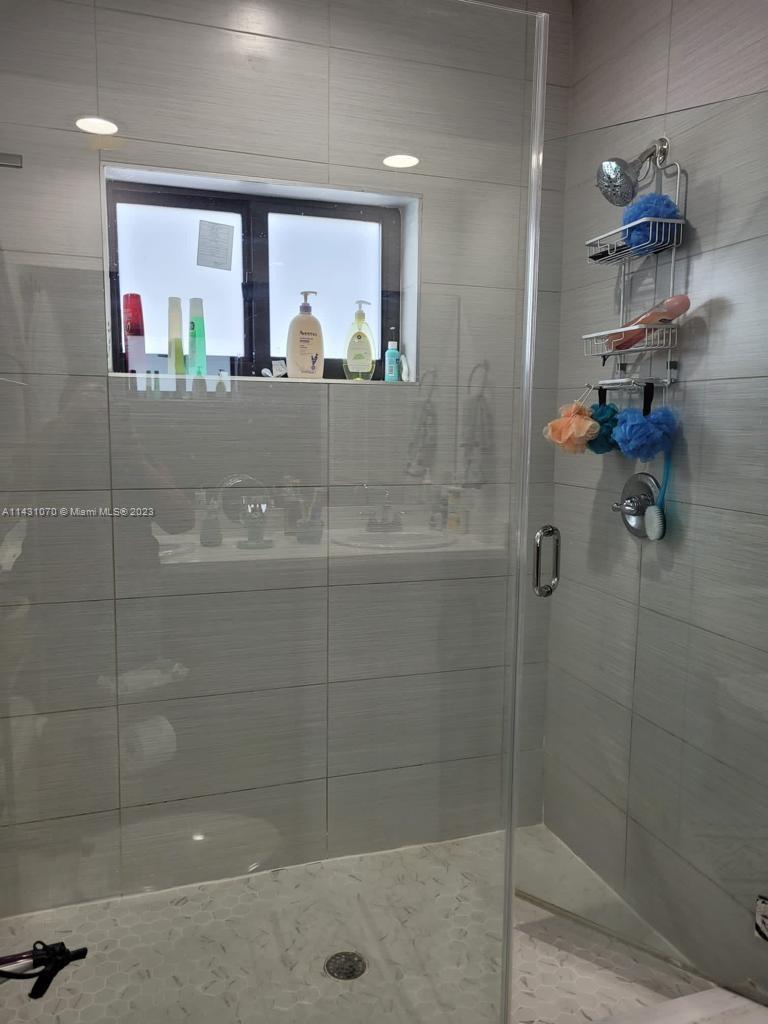 16383 Southwest 44th Terrace Miami, FL 33185 - Photo 17 of 24 a bathroom with a shower