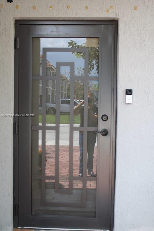 16383 Southwest 44th Terrace Miami, FL 33185 - Photo 2 of 24 view of a glass door