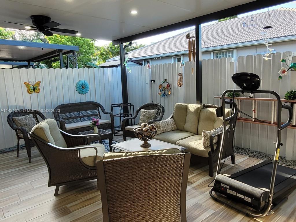 16383 Southwest 44th Terrace Miami, FL 33185 - Photo 24 of 24 a view of a patio with table and chairs