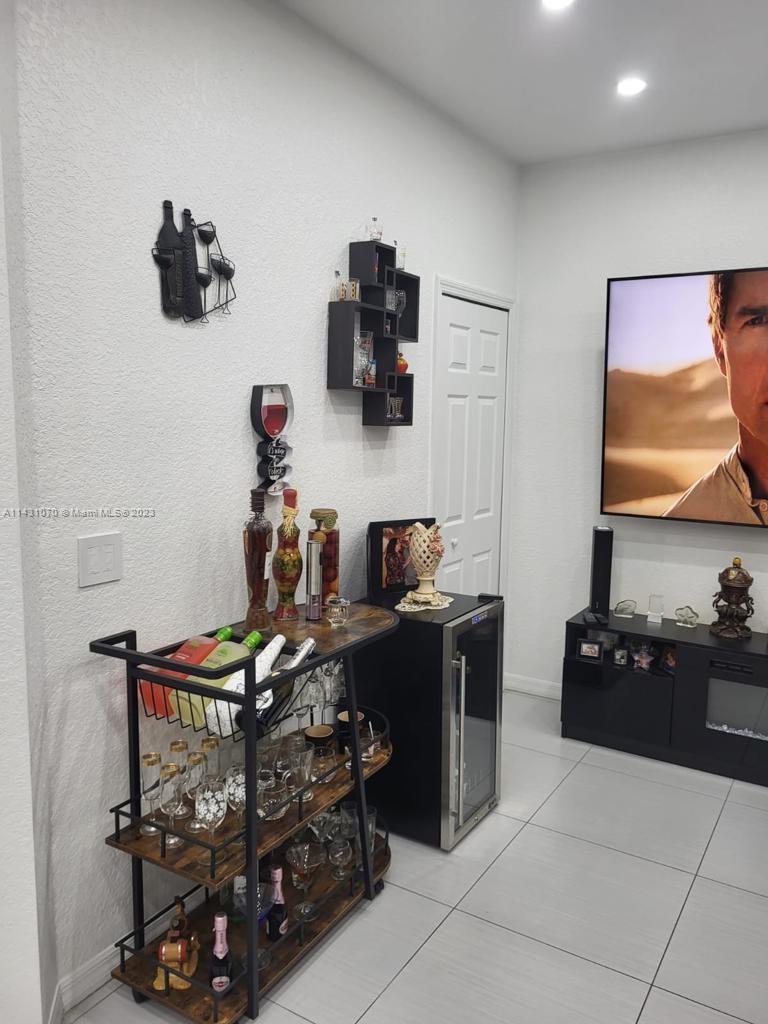 16383 Southwest 44th Terrace Miami, FL 33185 - Photo 8 of 24 a bedroom with a bed and a couch