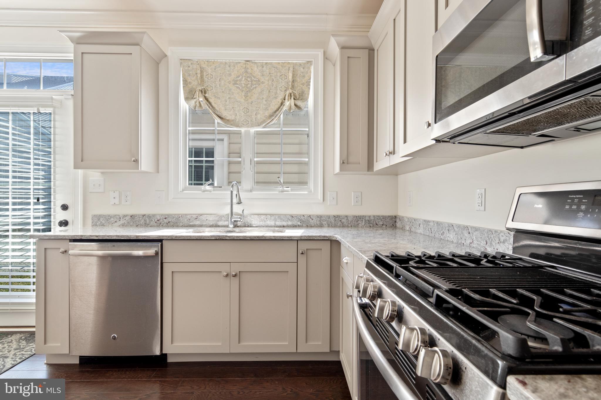626 D Street Kennett Square, PA 19348 - Photo 12 of 24 a kitchen with granite countertop a stove and a sink