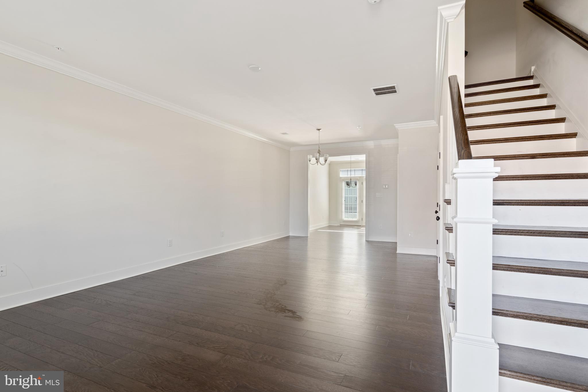 626 D Street Kennett Square, PA 19348 - Photo 5 of 24 a view of a livingroom with wooden floor and stairs