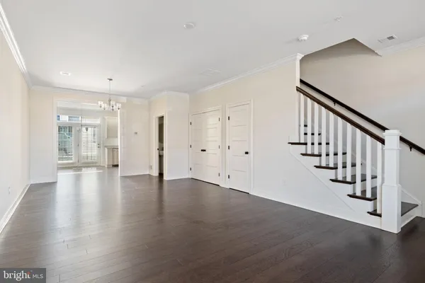 a view of an entryway with wooden floor