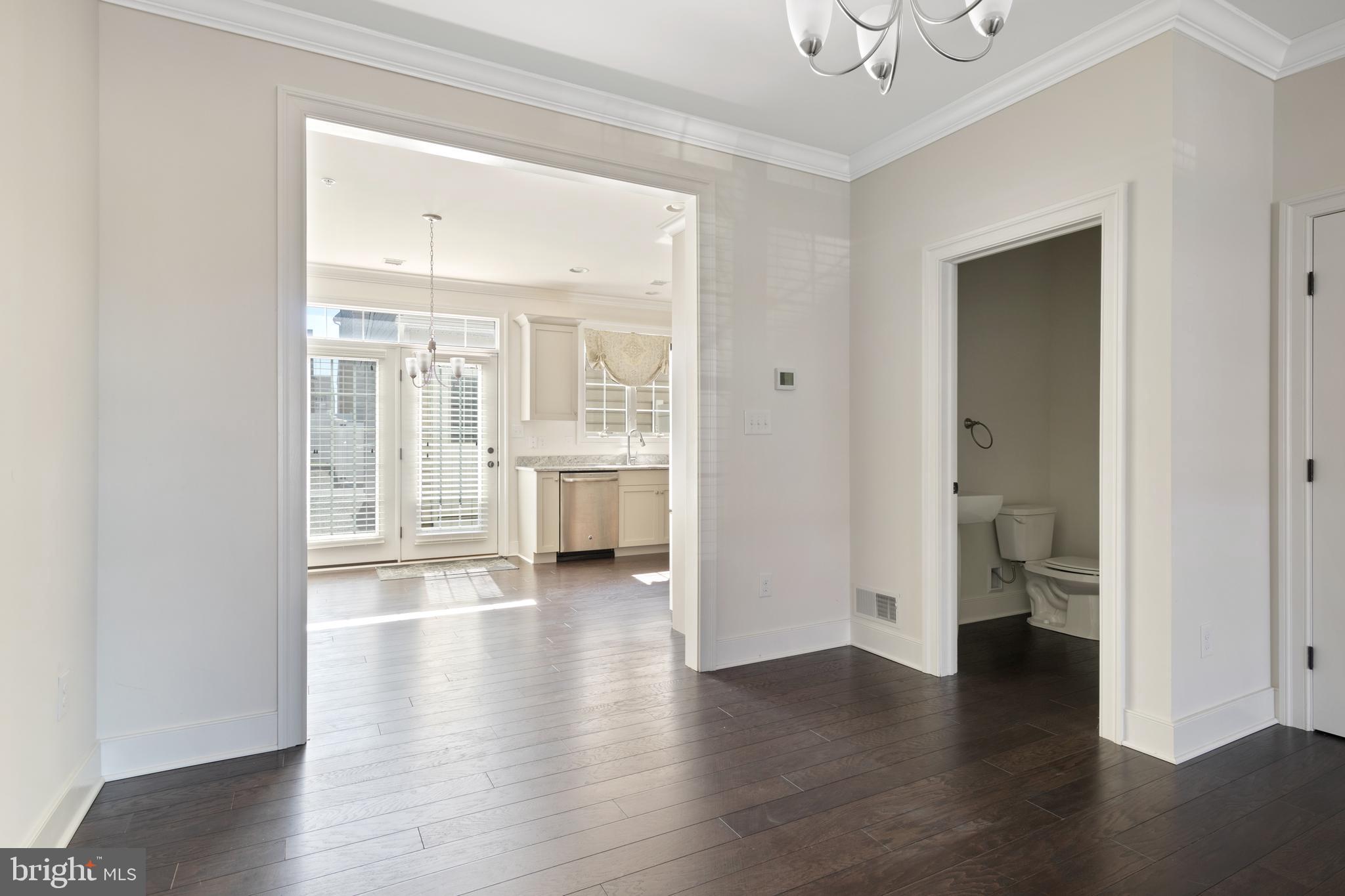 626 D Street Kennett Square, PA 19348 - Photo 8 of 24 a view of an empty room with a window and wooden floor