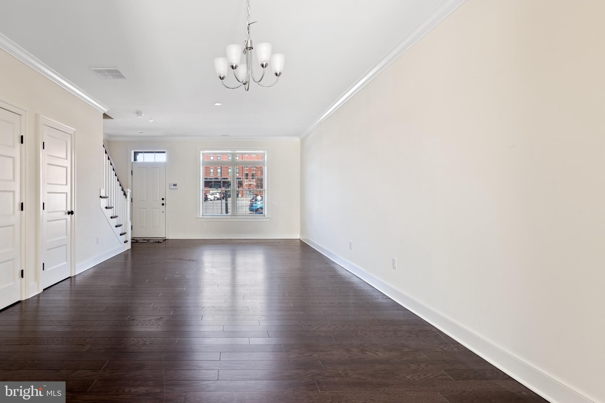 626 D Street Kennett Square, PA 19348 - Photo 9 of 24 an empty room with wooden floor and windows