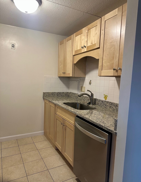 70 Nicholas Road, Unit 4 Framingham, MA 01701 - Photo 15 of 16 a kitchen with a sink stove and cabinets