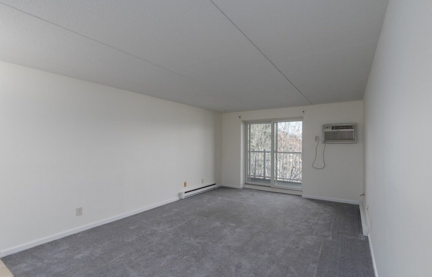 70 Nicholas Road, Unit 4 Framingham, MA 01701 - Photo 8 of 16 an empty room with windows