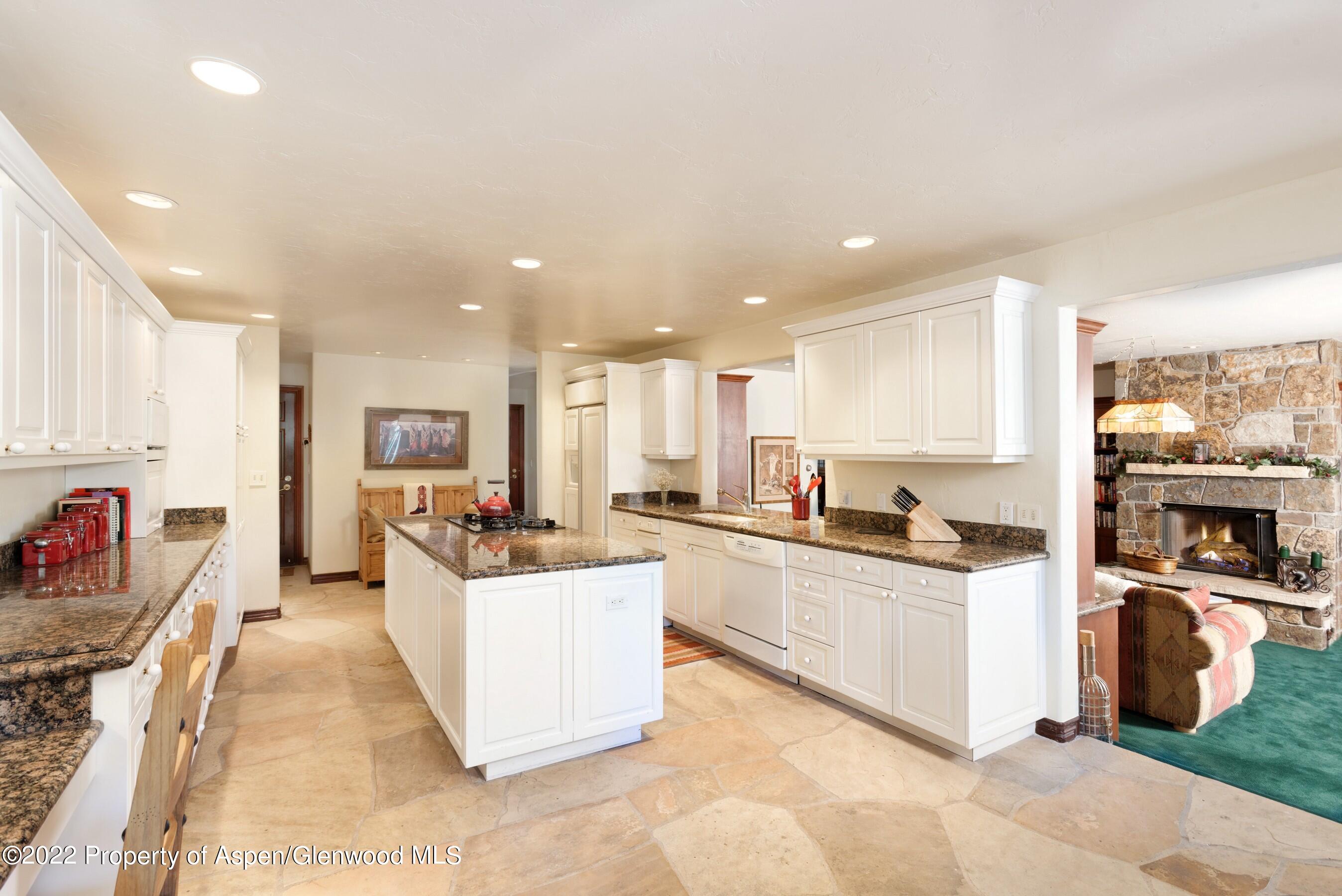 84 Diamond A Ranch Road Carbondale, CO 81623 - Photo 6 of 32 a kitchen with stainless steel appliances kitchen island granite countertop a refrigerator and a sink