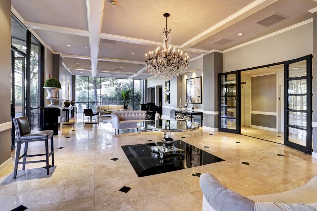 3350 McCue Road, Unit 1501 Houston, TX 77056 - Photo 22 of 38 a living room with furniture and a chandelier