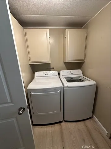 a bathroom with a double vanity sink toilet and mirror