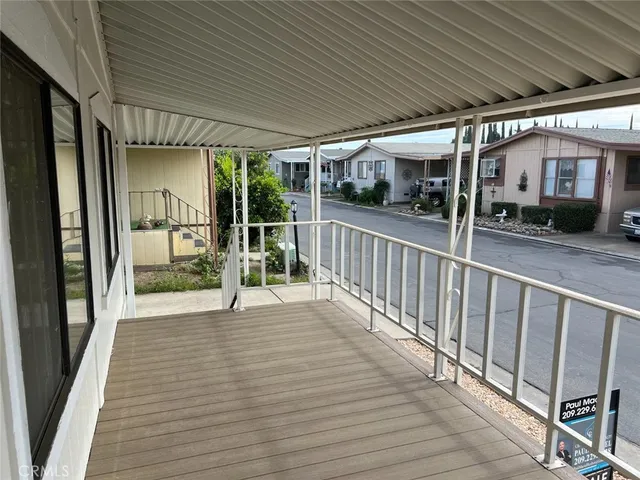 a view of a kitchen with a refrigerator and a stove