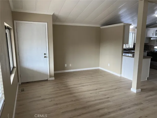 a kitchen with granite countertop a stove and a sink