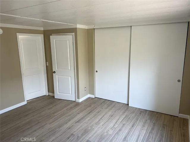 a white toilet sitting next to a bath tub