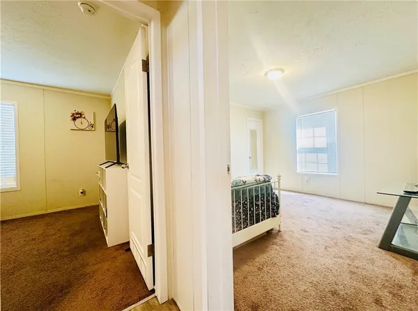 a view of hallway with walk in closet