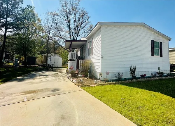a view of a house with snow on the road