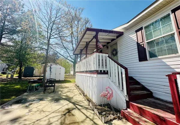 a view of backyard with sitting area