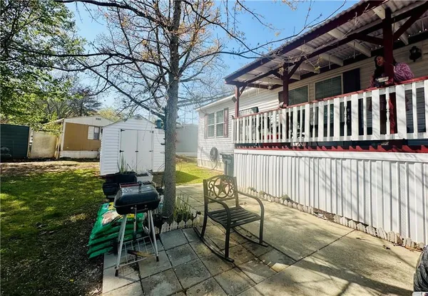 a view of a chair and tables in the patio
