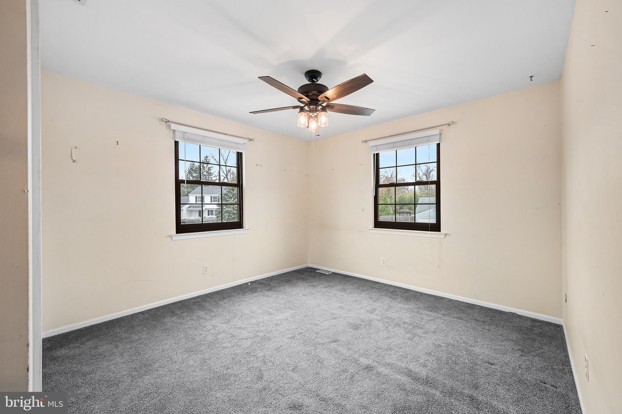 6 Tiffany Place Sicklerville, NJ 08081 - Photo 22 of 33 an empty room with windows and ceiling fan