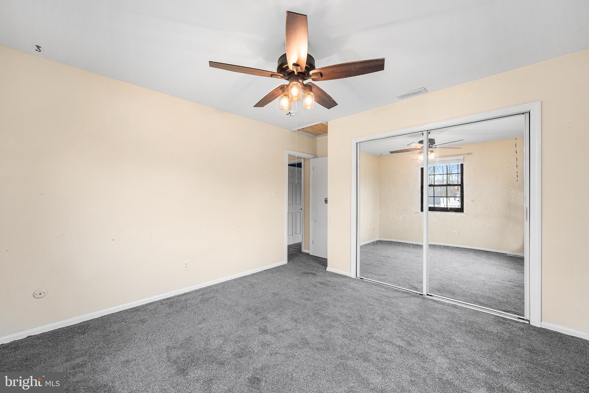 6 Tiffany Place Sicklerville, NJ 08081 - Photo 23 of 33 an empty room with closet and a chandelier fan