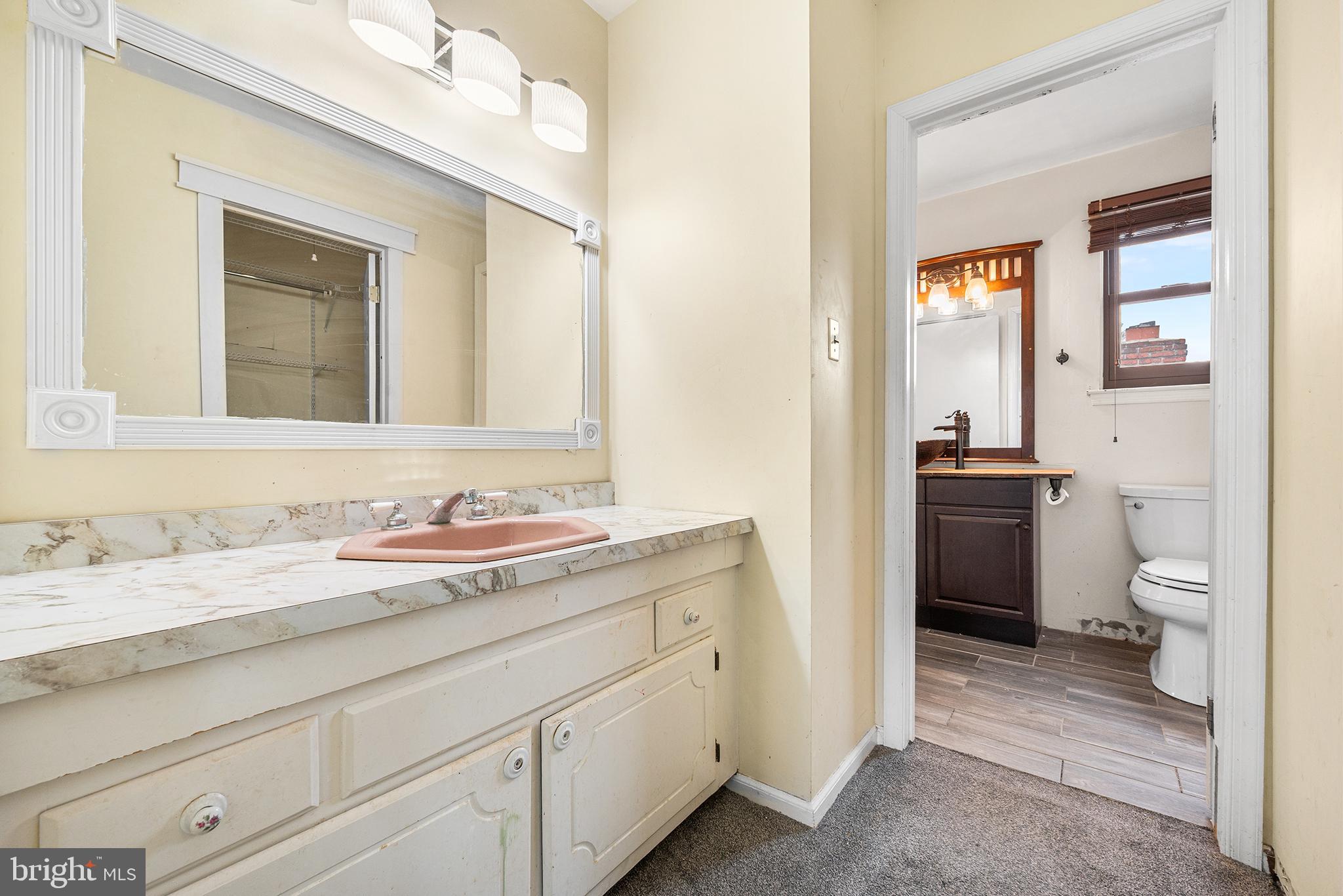 6 Tiffany Place Sicklerville, NJ 08081 - Photo 27 of 33 a bathroom with a granite countertop toilet sink and a mirror