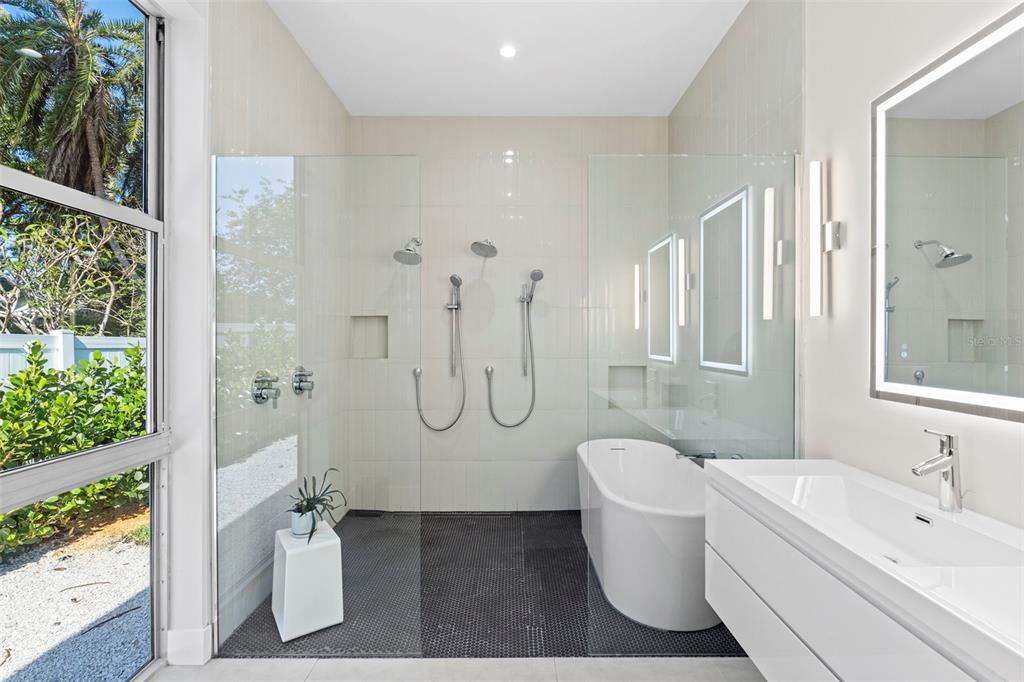 1304 Indian Rocks Road Belleair, FL 33756 - Photo 35 of 80 a bathroom with a granite countertop sink a toilet and shower