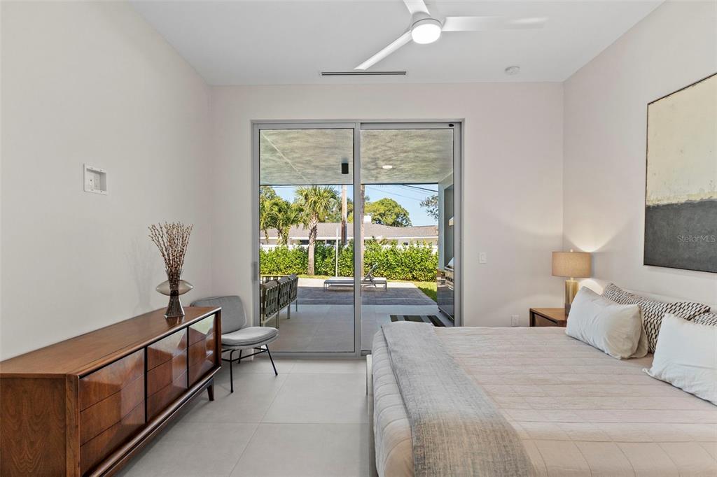 1304 Indian Rocks Road Belleair, FL 33756 - Photo 38 of 80 a bed room with a bed and a chair