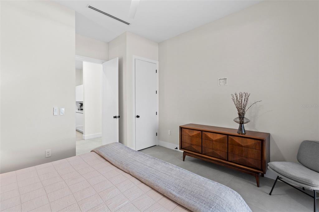 1304 Indian Rocks Road Belleair, FL 33756 - Photo 40 of 80 a bedroom with a bed and a couch