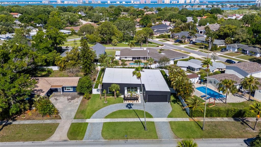 1304 Indian Rocks Road Belleair, FL 33756 - Photo 55 of 80 an aerial view of residential houses with outdoor space