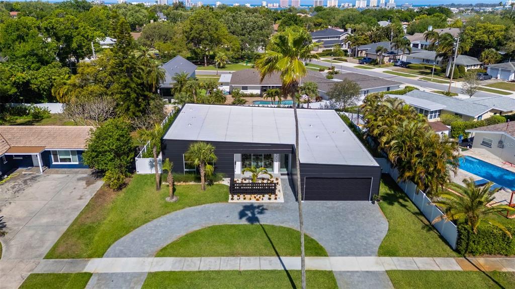 1304 Indian Rocks Road Belleair, FL 33756 - Photo 76 of 80 a aerial view of a house with a swimming pool