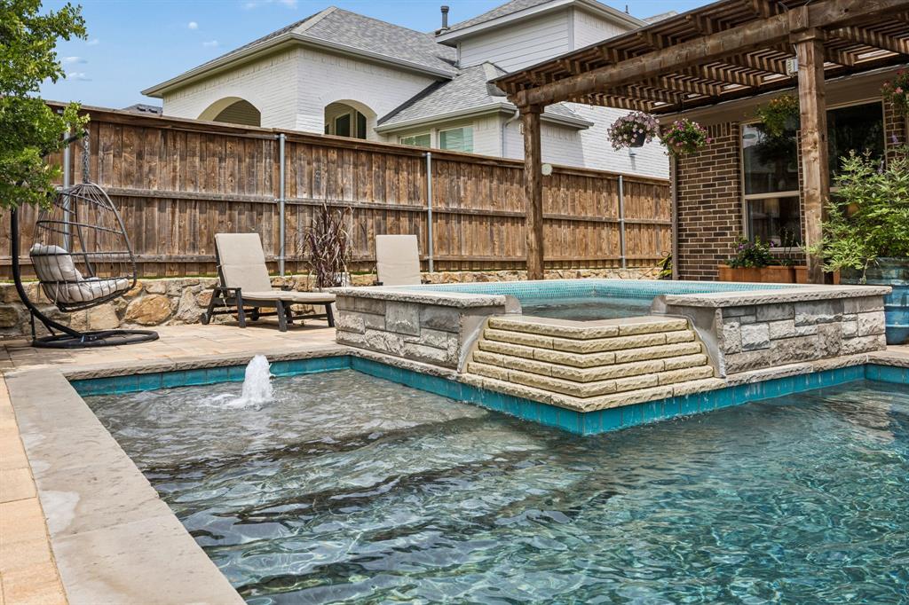 13617 Green Elm Road Fort Worth, TX 76008 - Photo 25 of 40 Heated pool with tanning ledge and spa