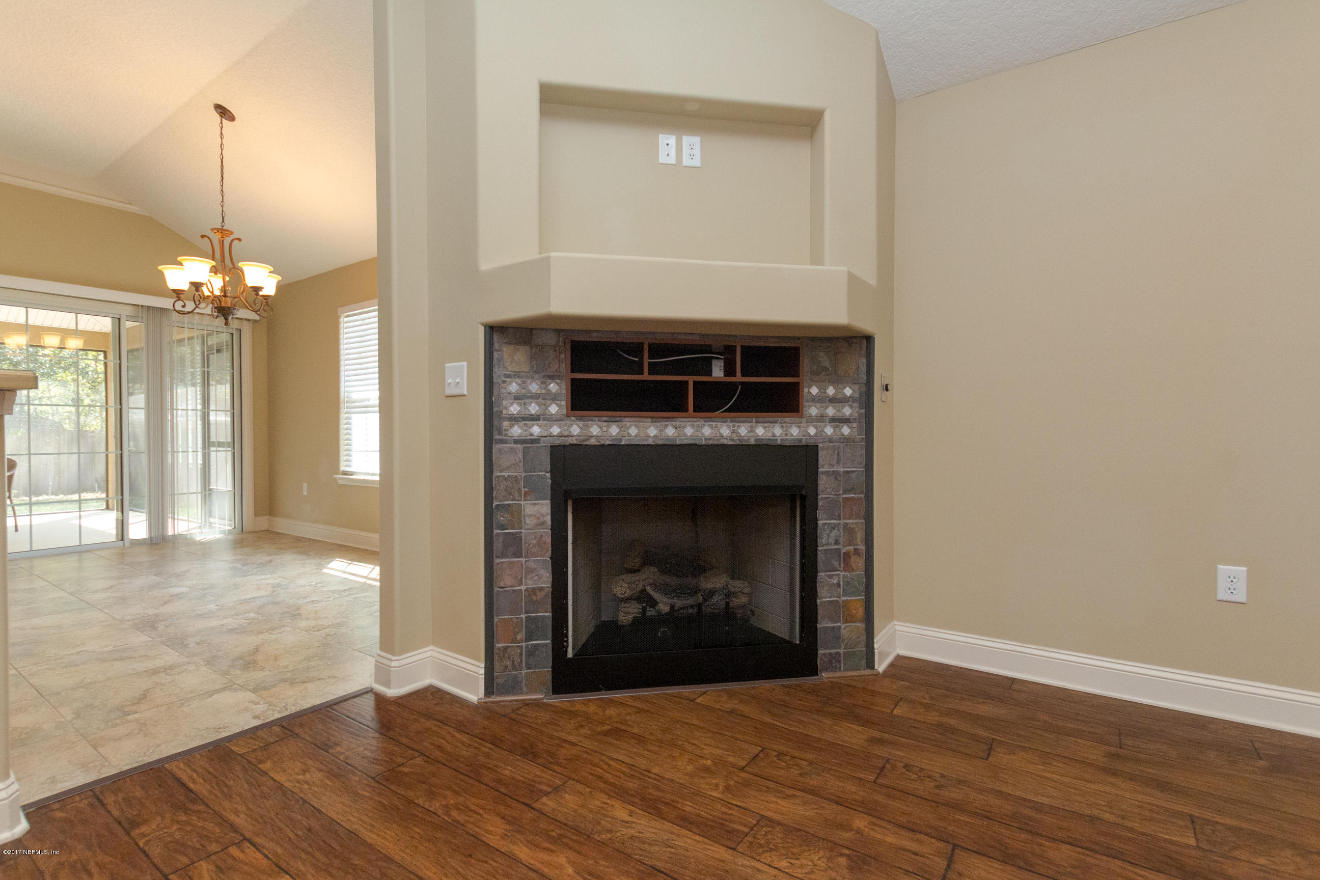 12865 Beaubien Road Jacksonville, FL 32258 - Photo 6 of 28 a view of a livingroom with a fireplace and window