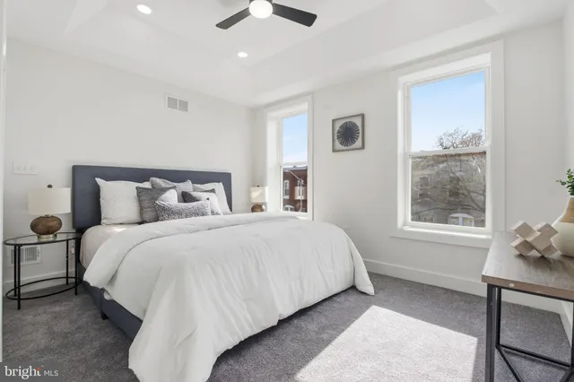 a bedroom with a bed and window