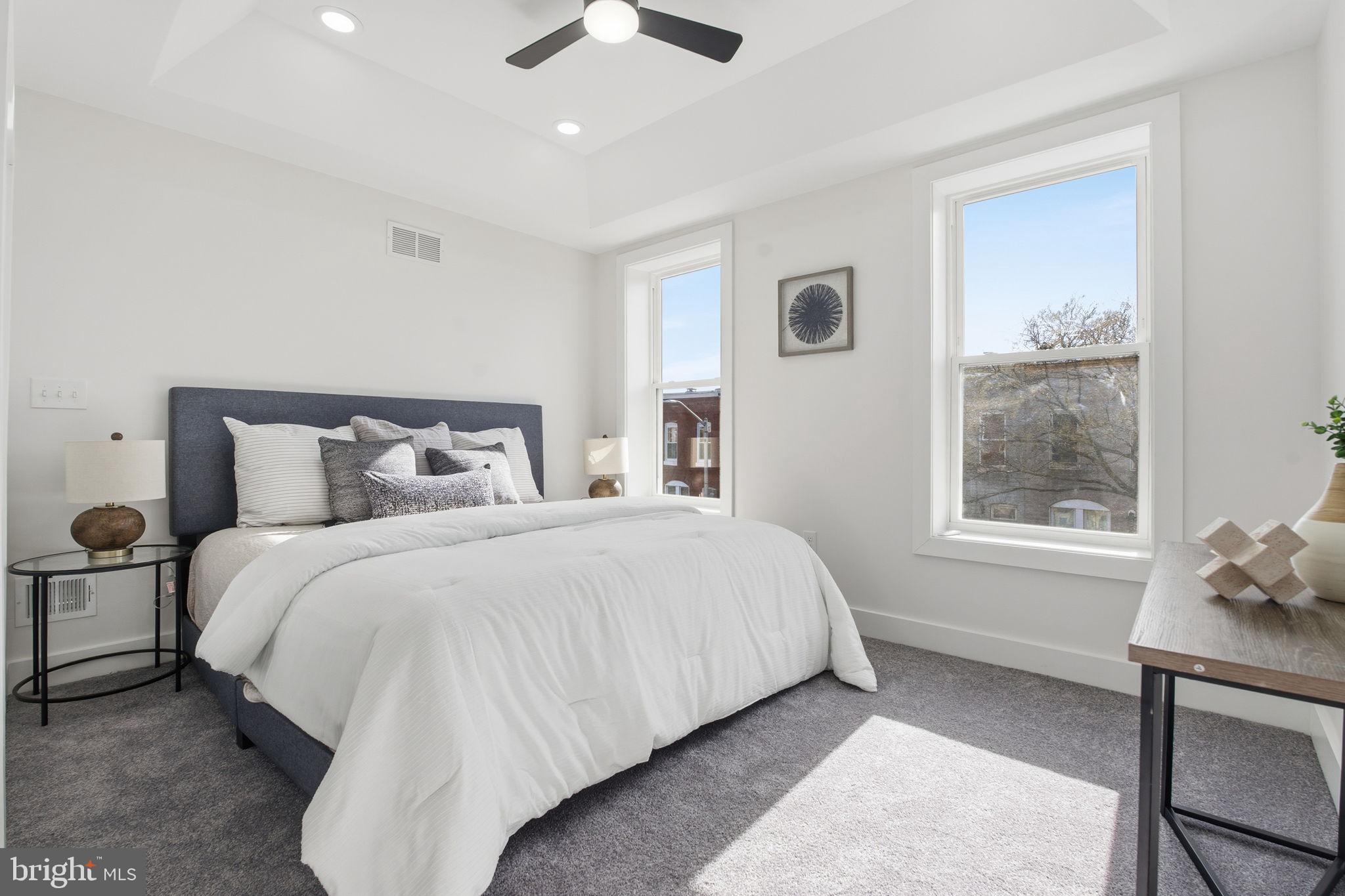 1742 East Oliver Street Baltimore, MD 21213 - Photo 15 of 36 a bedroom with a bed and window