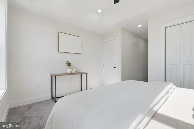 a bedroom with a bed and a table