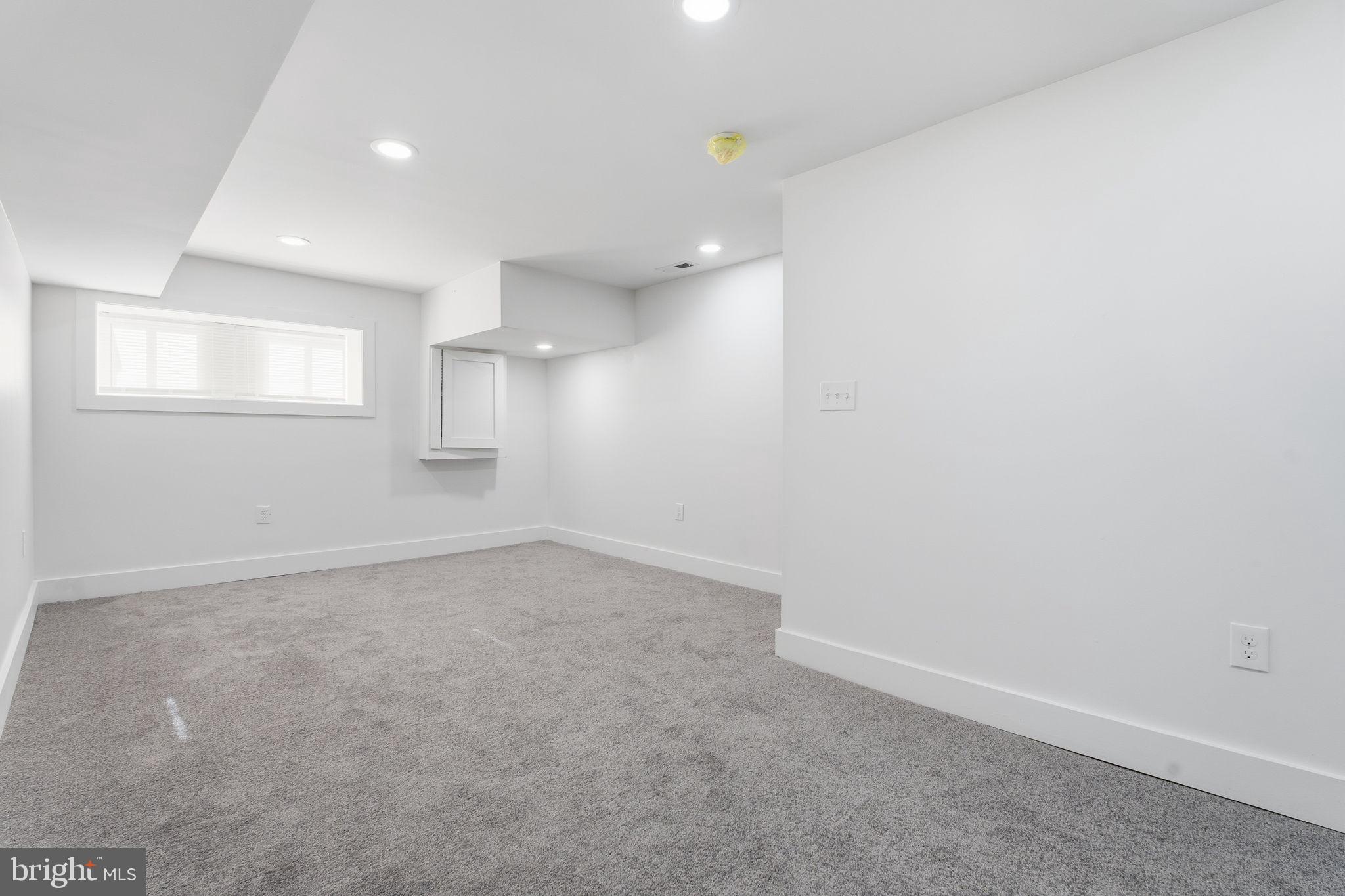 1742 East Oliver Street Baltimore, MD 21213 - Photo 30 of 36 an empty room with a empty space and windows