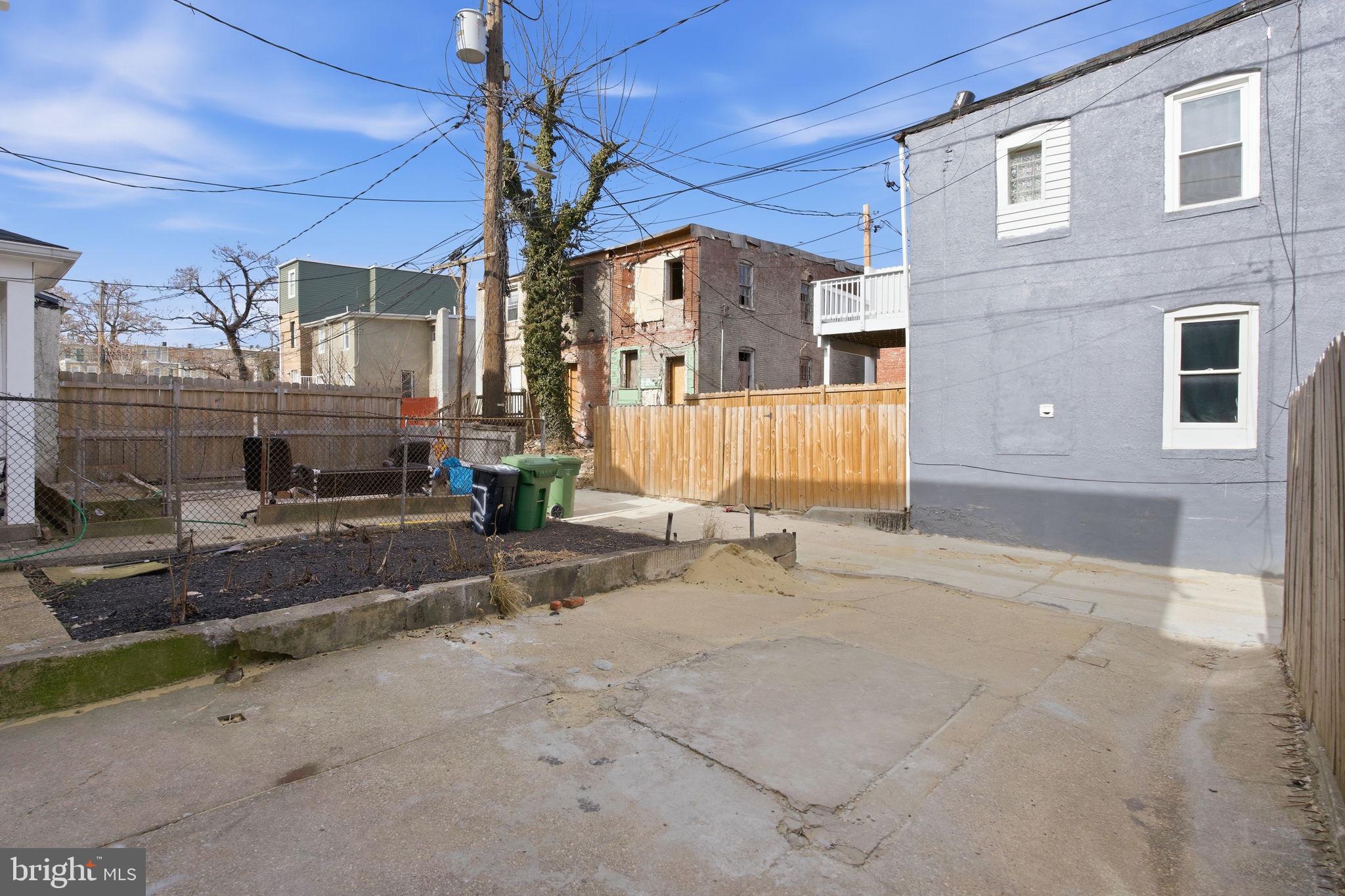 1742 East Oliver Street Baltimore, MD 21213 - Photo 35 of 36 a view of a building with a street